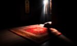 red-prayer-rug-dark-room-with-light-from-back-window